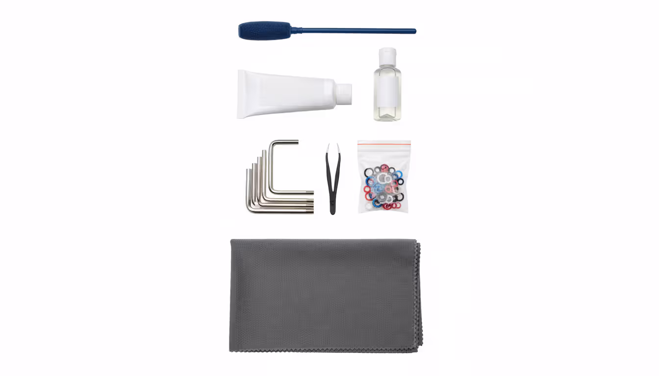Complete paintball marker cleaning kit flat lay with tools and supplies