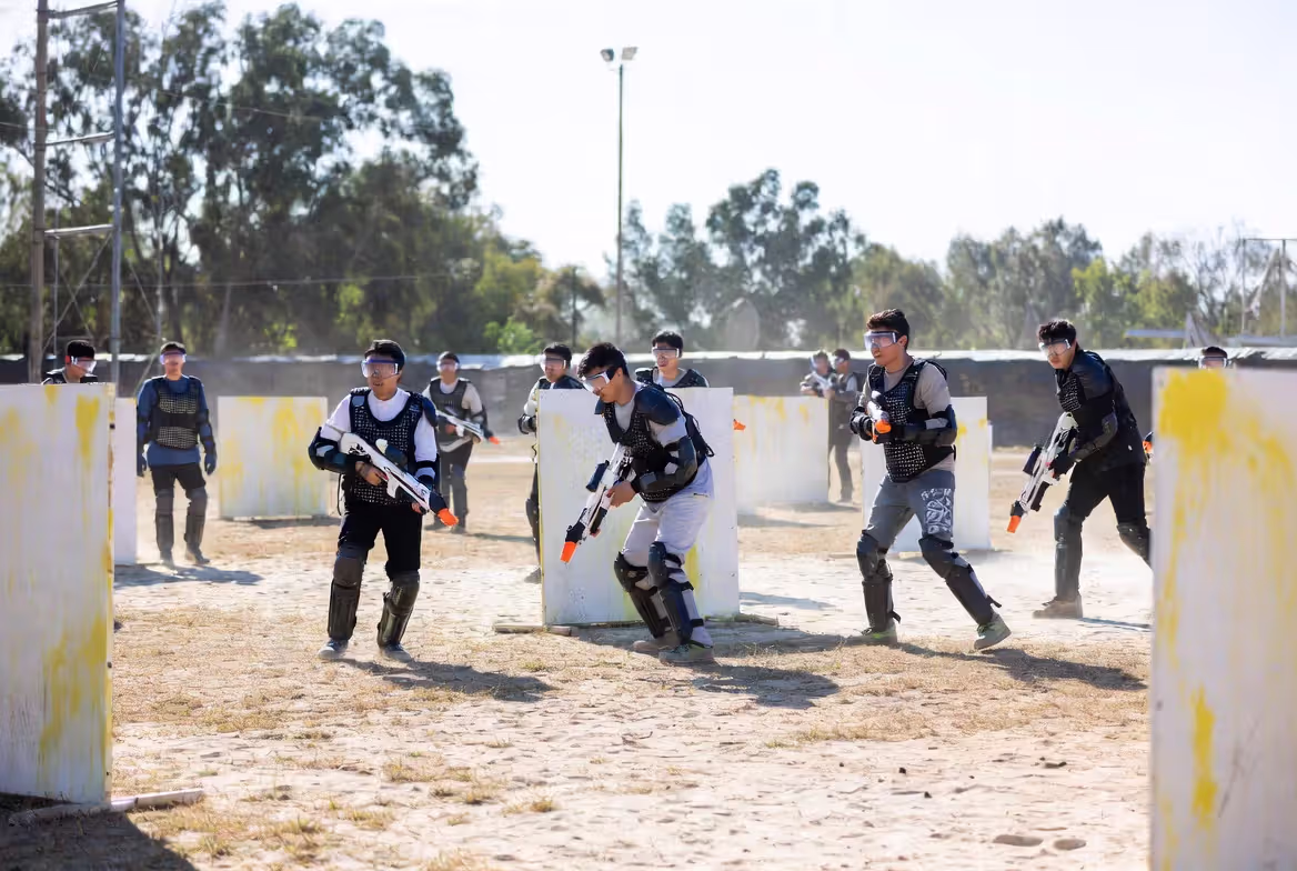 people using gel blasters with safety gear in controlled environment