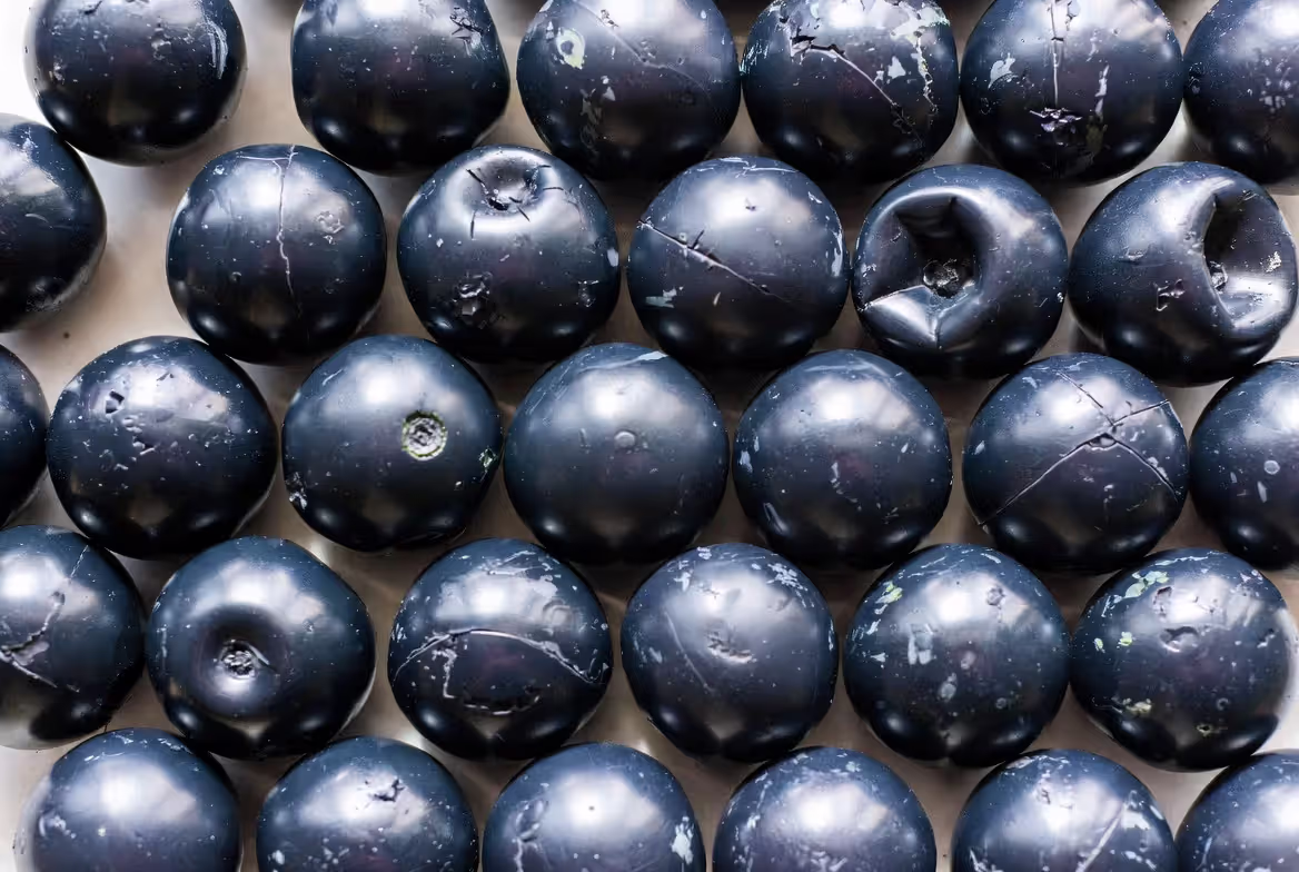 damaged paintballs with dimpling cracks and discoloration