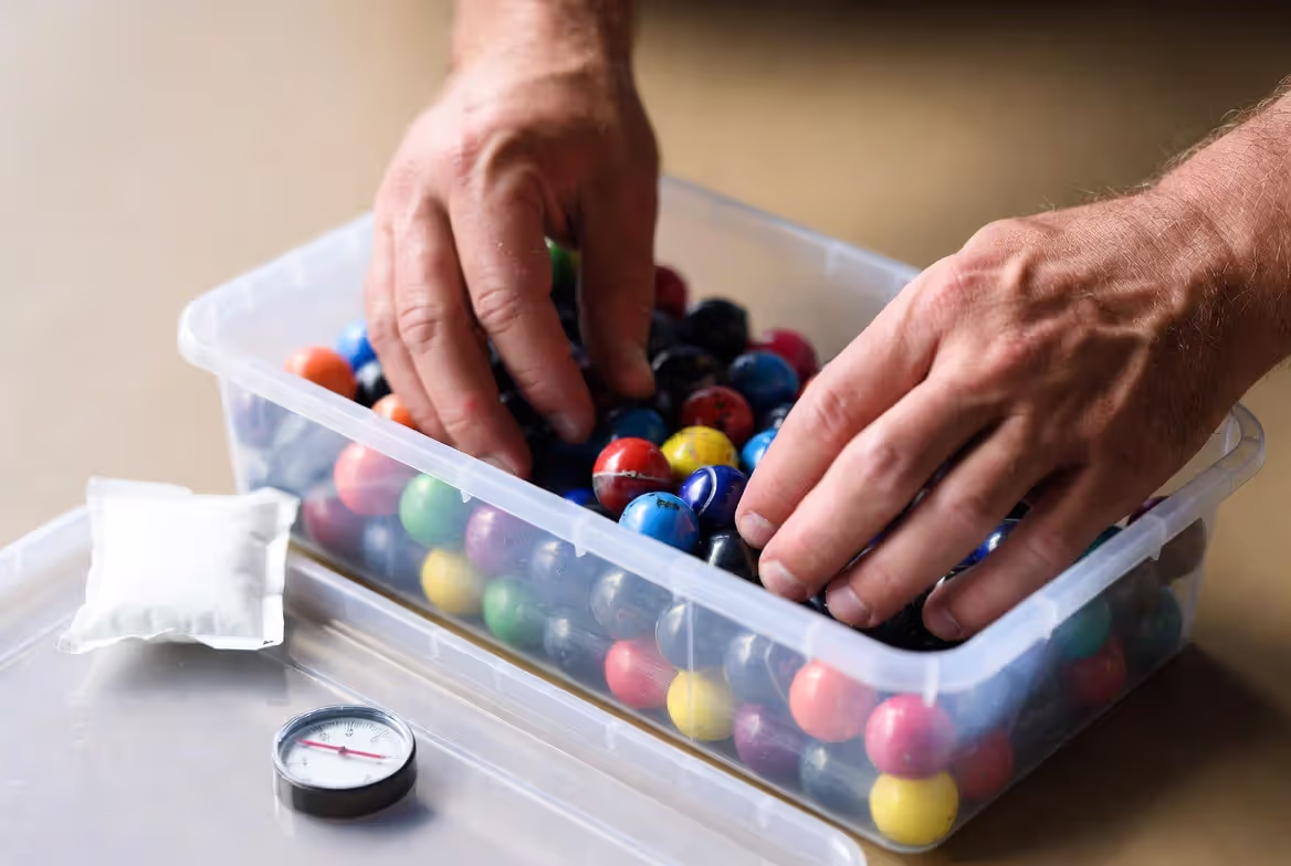 storing paintballs in airtight container with humidity control