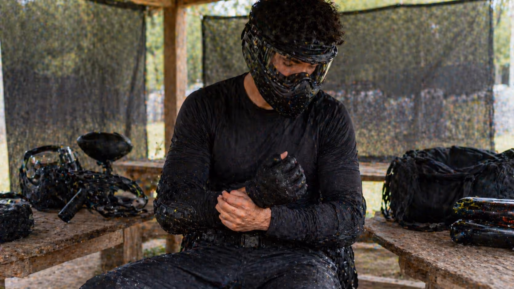 wearing dark protective clothing to prevent visible paintball stains