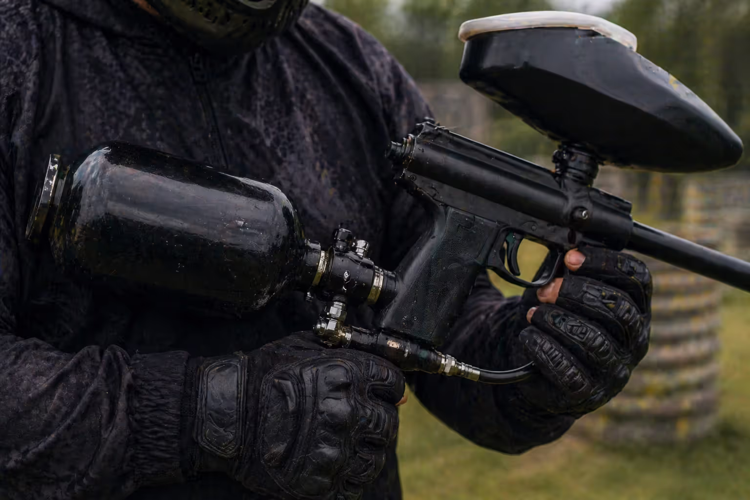close up of CO2 tank powering paintball marker